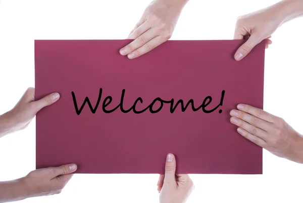 Many Hands Holding A Paper With Welcome — Stock Photo, Image