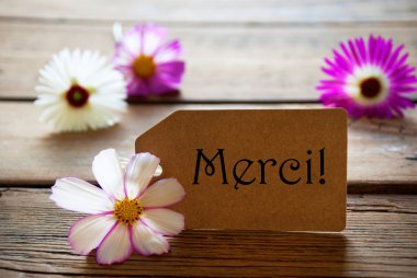 Fransızca metin Merci Cosmea çiçekleri ile etiketle