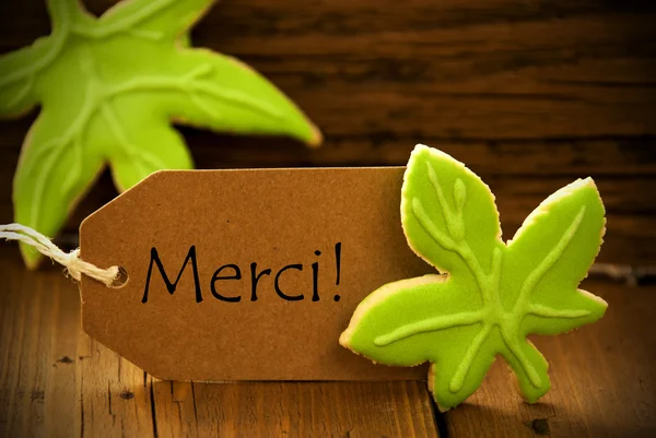 Brązowy ekologicznego z tekstem w języku francuskim Merci — Zdjęcie stockowe