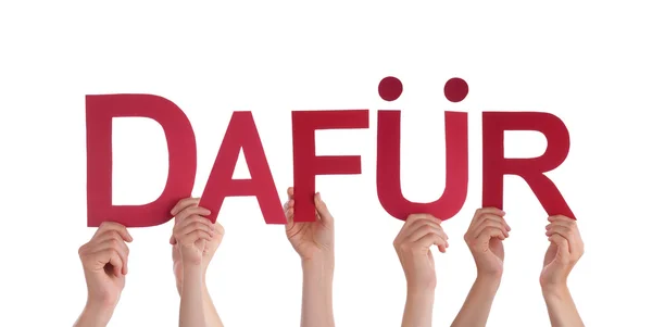 Menschen, die ein rotes geradliniges deutsches Wort dafuer in der Hand halten — Stockfoto