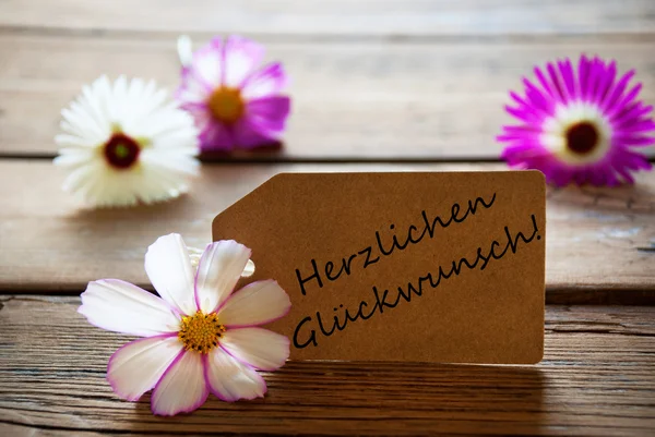 Label With German Text Herzlichen Glueckwunsch Means Best Wishes With Cosmea Blossoms — Stock Photo, Image