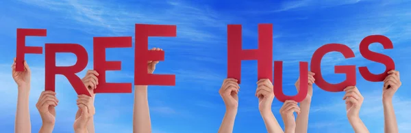 People Hands Holding Red Word Free Hugs Blue Sky — Stock Photo, Image