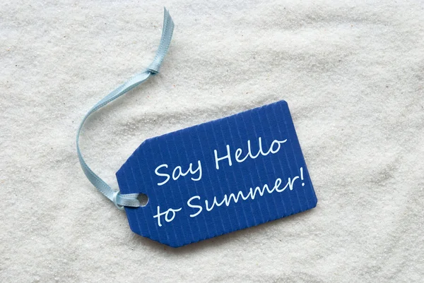 Say Hello To Summer On Blue Label Sand Background — Stock Photo, Image