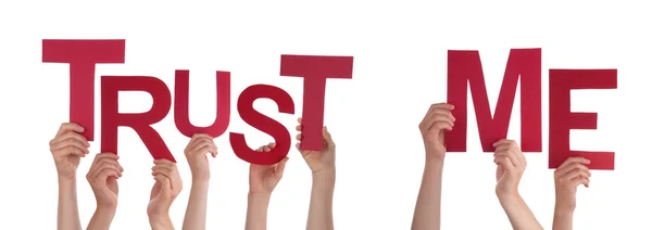 People Hands Holding Red Word Trust Me — Stock Photo, Image