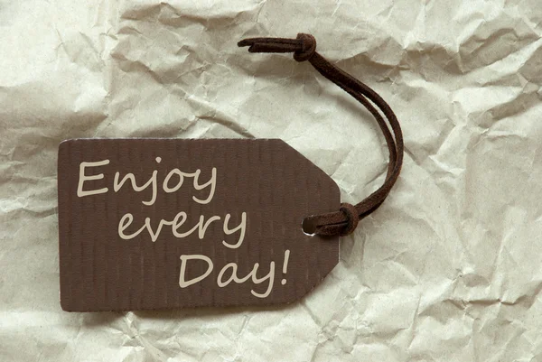 Brown Label with Quote Enjoy Every Day Paper Background — стоковое фото