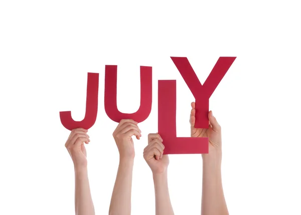 Sok ember kezei piros szó július — Stock Fotó