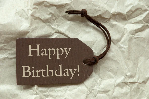 Etiqueta marrom com fundo de papel de aniversário feliz — Fotografia de Stock