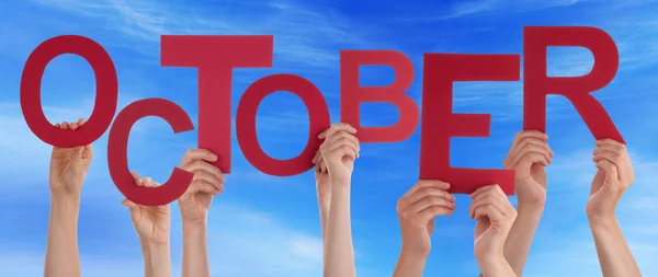 People Hands Holding Red Word October Blue Sky — Stock Photo, Image