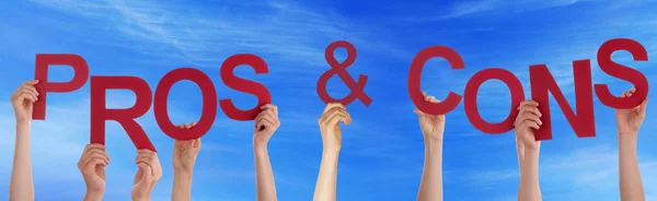 Hands Holding Red Word Pros And Cons Blue Sky — Stock Photo, Image