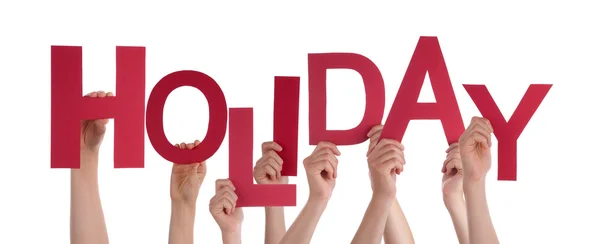 Muitas pessoas mãos segurando Red Word Holiday — Fotografia de Stock
