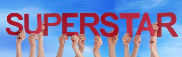 Hands Holding Red Straight Word Superstar Blue Sky — Stock Photo, Image