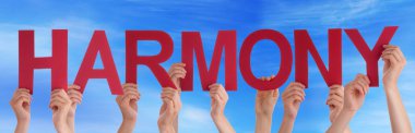 Kırmızı düz Word Harmony Holding eller mavi gökyüzü