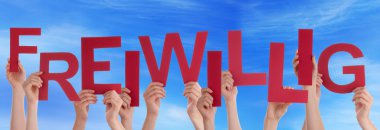 İnsanlar tutun kırmızı Alman Freiwillig anlamına gelir gönüllü