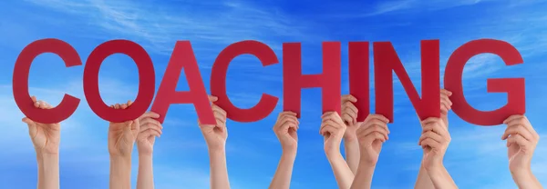 Hands Holding Red Straight Word Coaching Blue Sky — Stock Photo, Image
