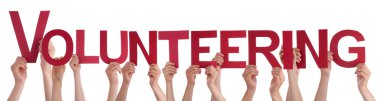 Hands Holding Red Straight Word Volunteering