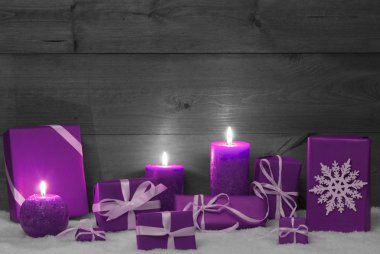Christmas Decoration With Pruple Candles, Presents And Snow