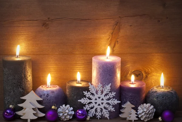 Christmas Decoration With Puprle And Black Candles, Ornament — 图库照片