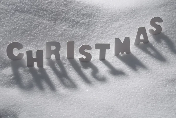 Palavra branca Natal na neve — Fotografia de Stock