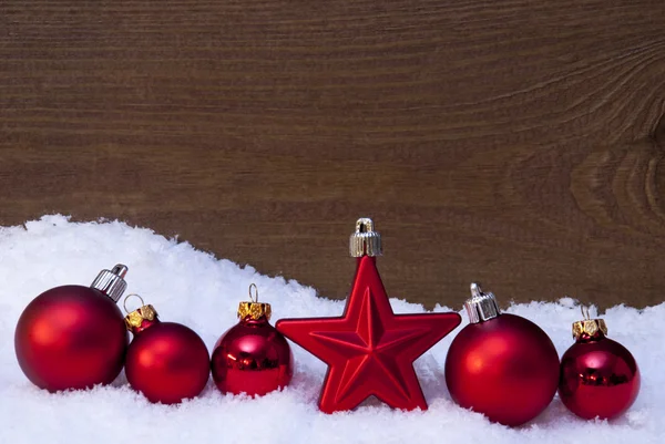 Wooden Christmas Background On Snow, Red Balls And One Star — Stockfoto