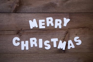 Wooden Background With White Letters Merry Christmas