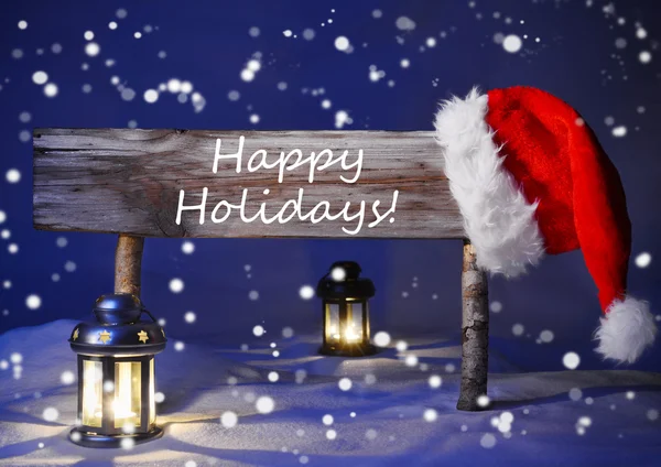 Weihnachtskarte mit Schild, Weihnachtsmütze bei Kerzenschein, frohe Feiertage — Stockfoto