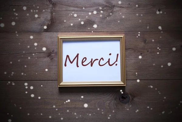 Gouden Picture Frame met Merci middelen dank u en sneeuwvlokken — Stockfoto