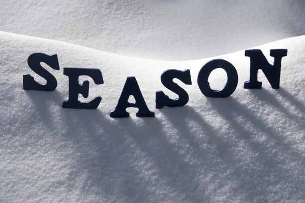 Temporada palavra azul na neve — Fotografia de Stock