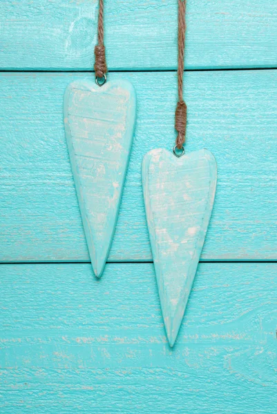 Two Hearts With Copy Space, Turquoise Wooden Background, Vertical Image — Stock Photo, Image