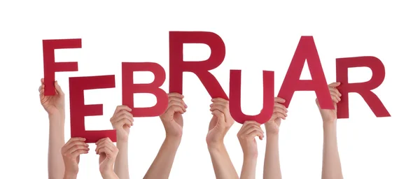 People Holding German Word Februar Means February — Stok fotoğraf