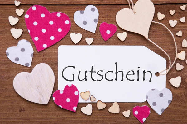 Etiqueta com coração rosa, Gutschein significa voucher — Fotografia de Stock