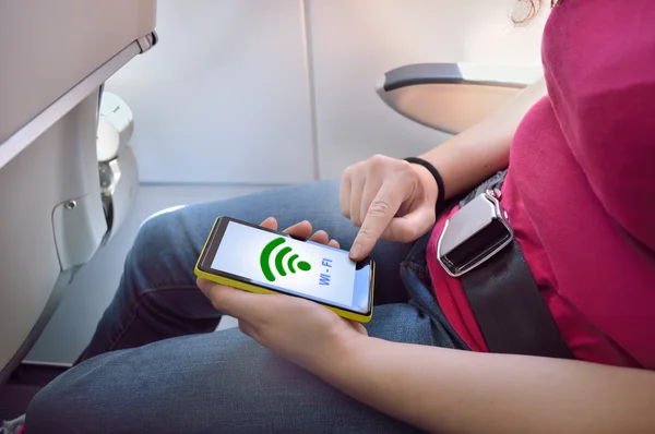 Using the wifi at the flight — Stock Photo, Image