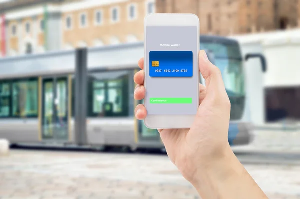 Smart mobile with wallet from tram — Stock Photo, Image