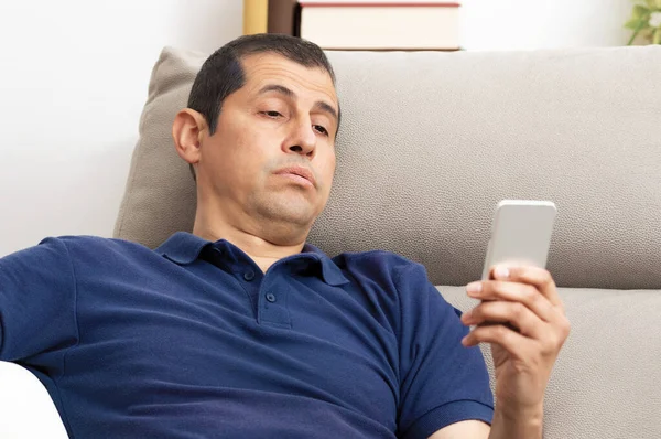 Bored Man Checking Mobile Phone Sitting Couch Living Room Home — Stock Photo, Image