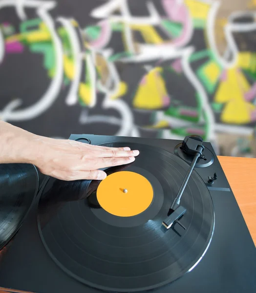 DJ mixing with a background of graffiti — Stock Photo, Image