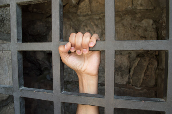 close uo of hand of a prisoner 