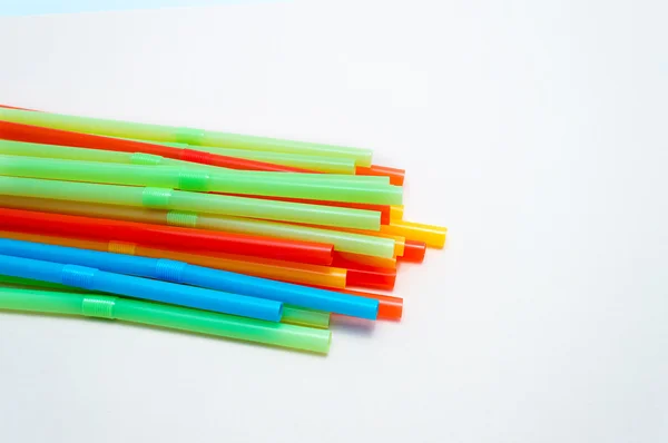 Colored plastic drinking straws on a white background — Stock Photo, Image