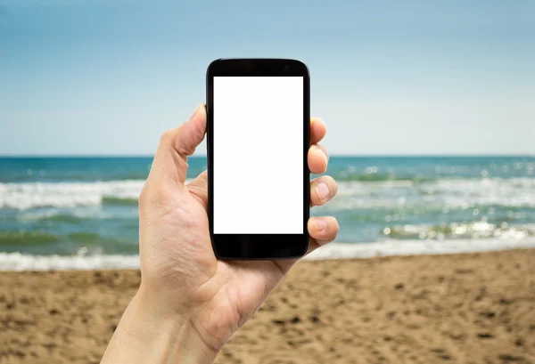 Smartphone na plaży — Zdjęcie stockowe