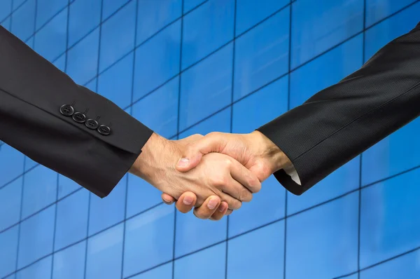 Handshake in an office — Stock Photo, Image