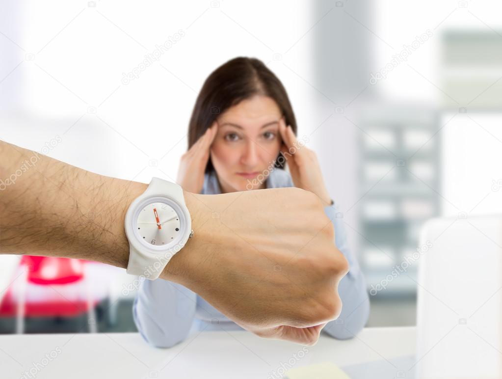 woman stressed by the punctuality at the office