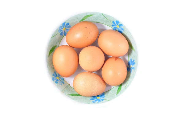 Skupina hnědých vajíček v misce — Stock fotografie