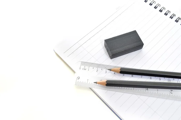 Blank page with pencils, eraser and ruler — Stock Photo, Image