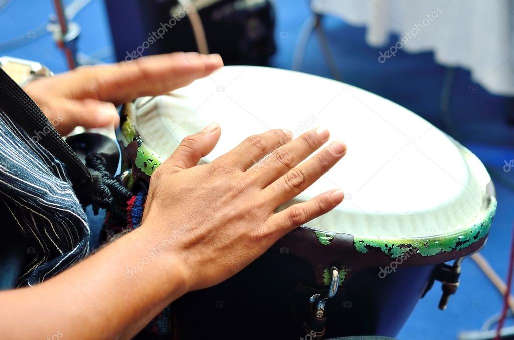 Male hands playing the drum