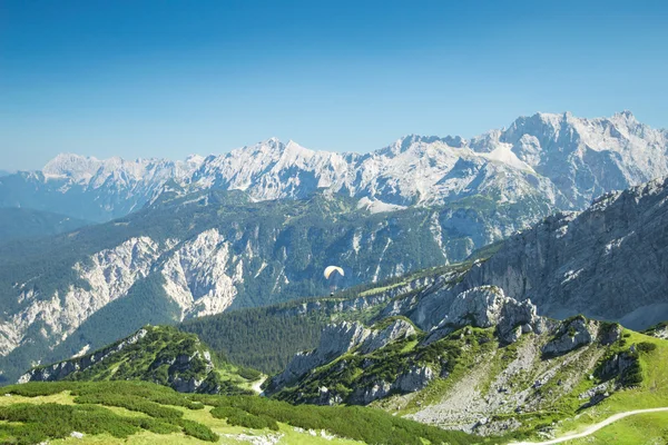 Alps mountains aerial view with paraglider over Alpine landscape — Stock Photo, Image