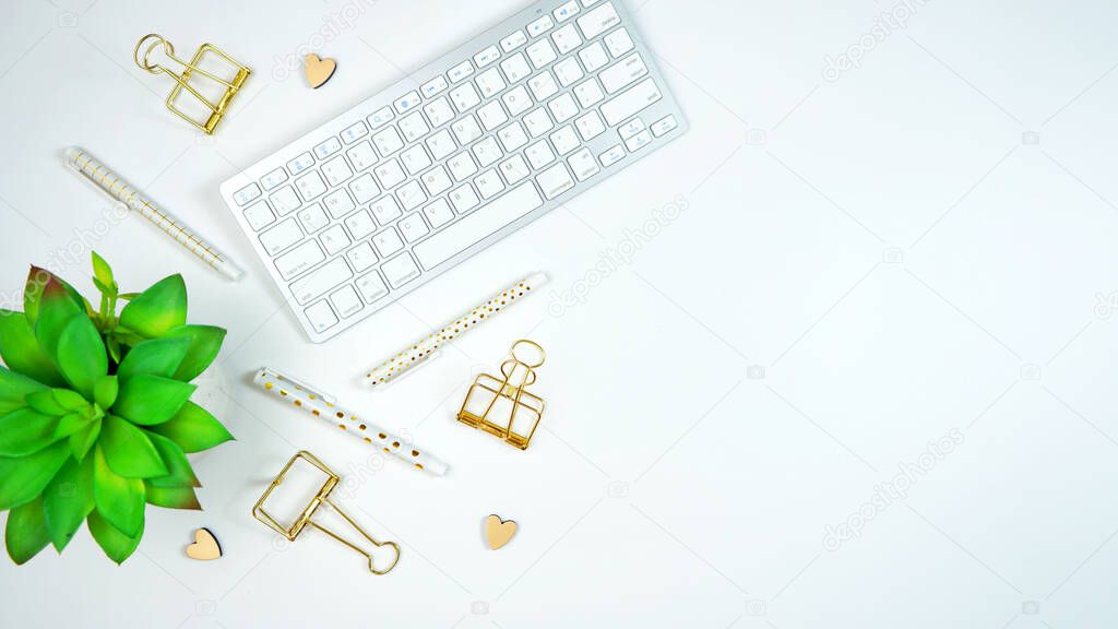 Stylish white and gold theme desktop workspace flat lay.