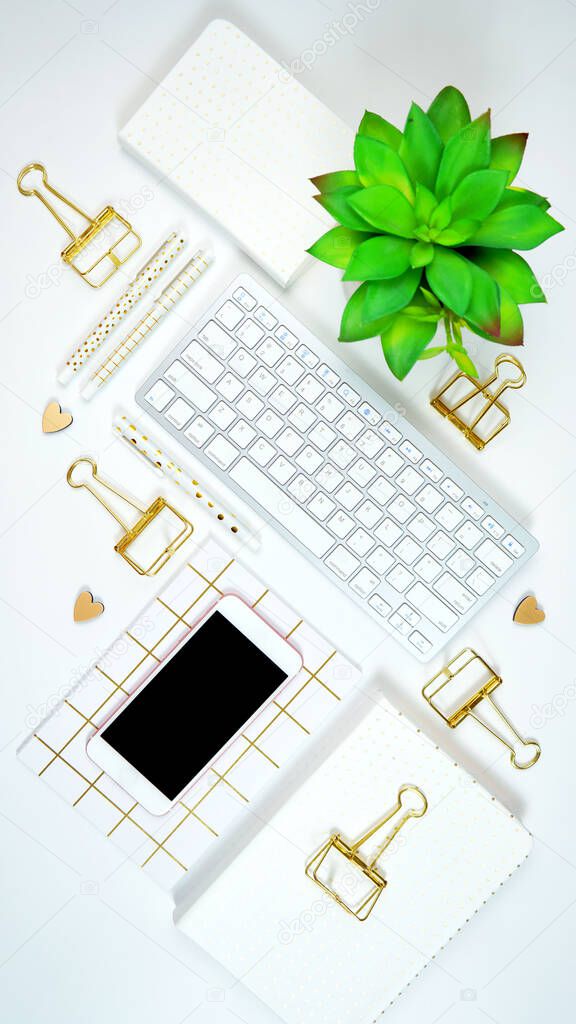 Stylish white and gold theme desktop workspace flat lay.