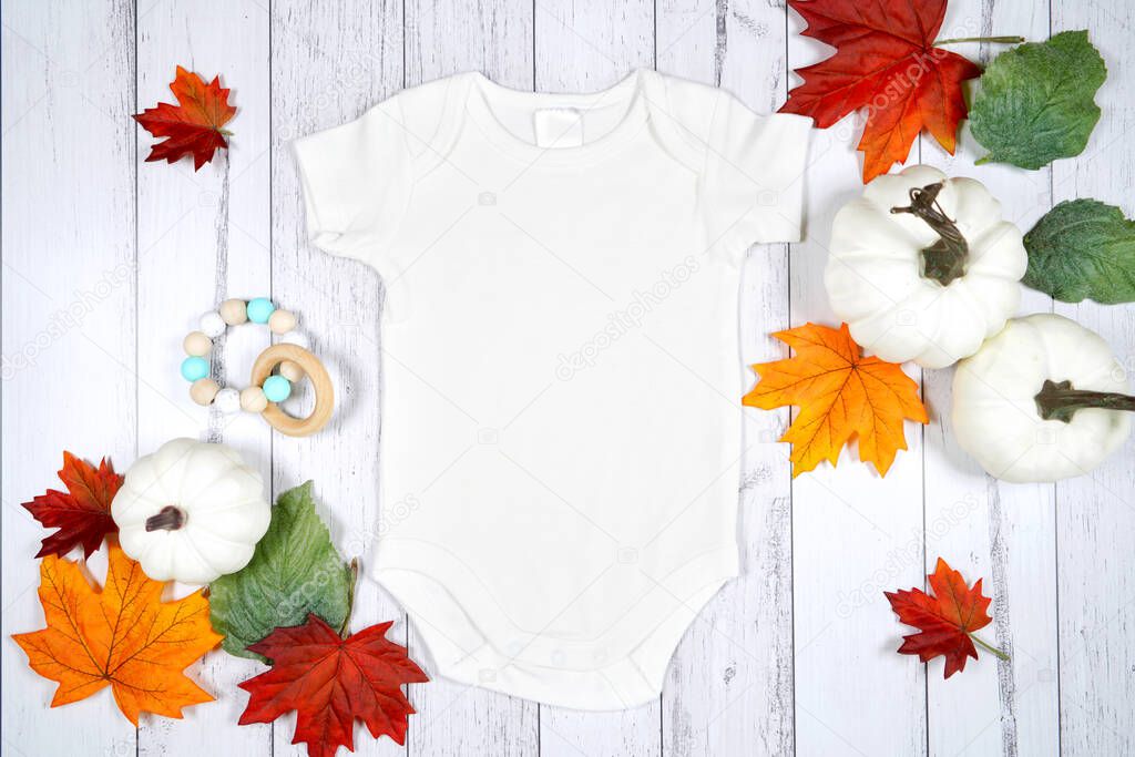 Halloween trick or treat product mockup with autumn leaves and white pumpkins.