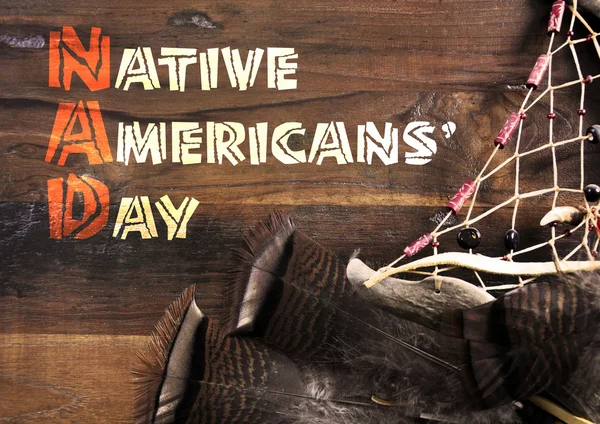 Native Americans Day wood carving style greeting text on dark rustic recycled wood — Stock Photo, Image