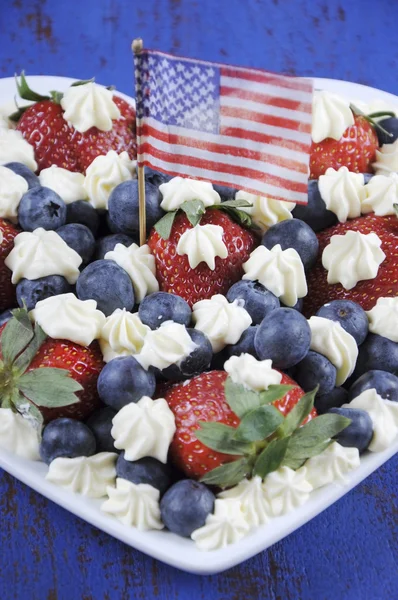 Red white and blue berries with fresh whipped cream stars. — Stock Photo, Image