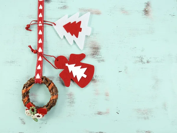 Modern Christmas red and white ornaments on aqua blue vintage wood background. — Stock Photo, Image