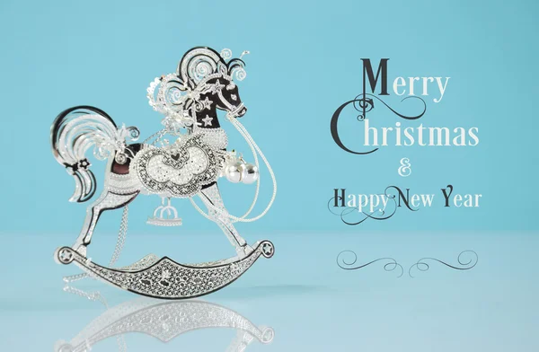 Beautiful vintage silver rocking horse ornament with sample text — Stock Photo, Image